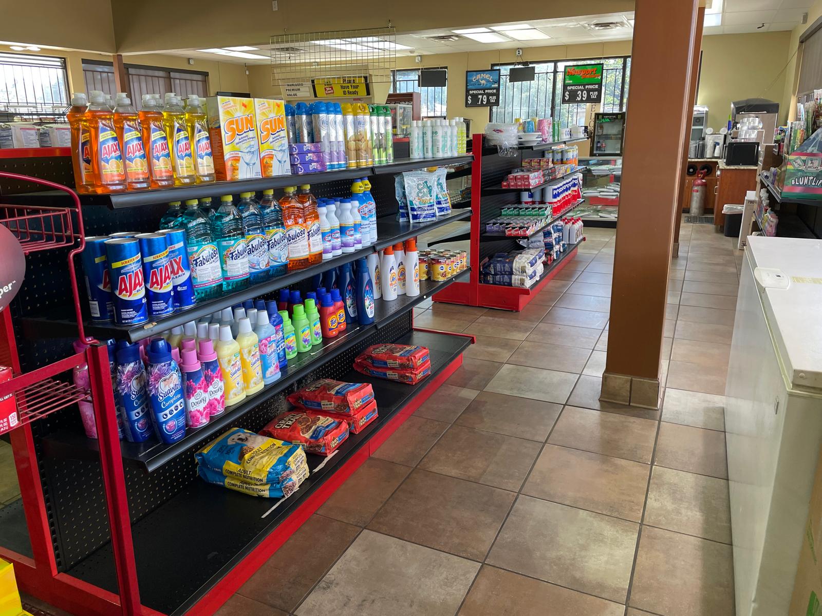 ZSM Express beverage aisle featuring energy drinks, automotive products, and ATM service